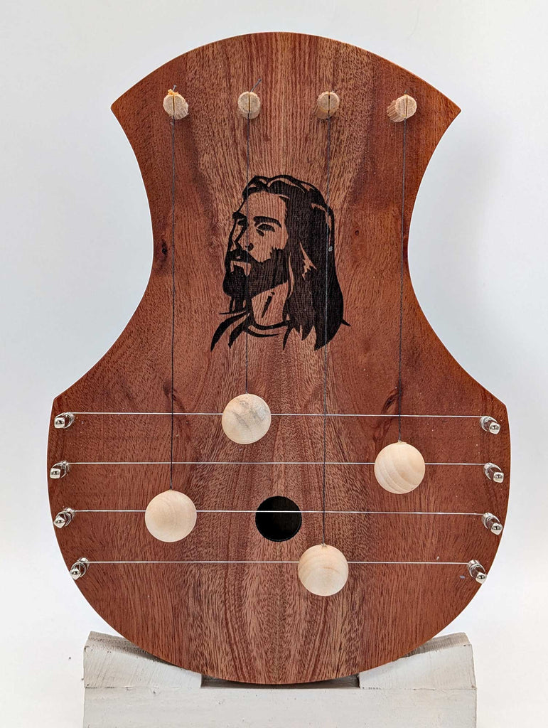 Mahogany wood door harp with etched head of Jesus.